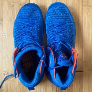 Russell Westbrook orange and blue air Jordan’s